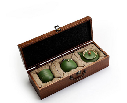 Traditional Japanese tea set with teapot and cups in an elegant wooden box.