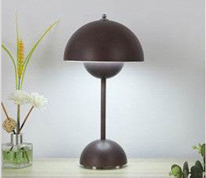Iconic FlowerPot Lamp with geometric dome design on a table.