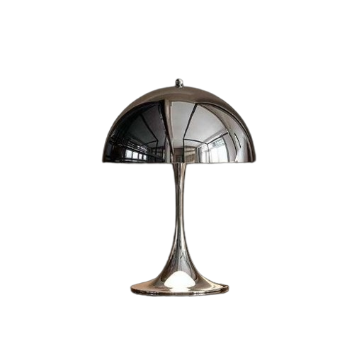Silver table lamp with reflective shade on a white background