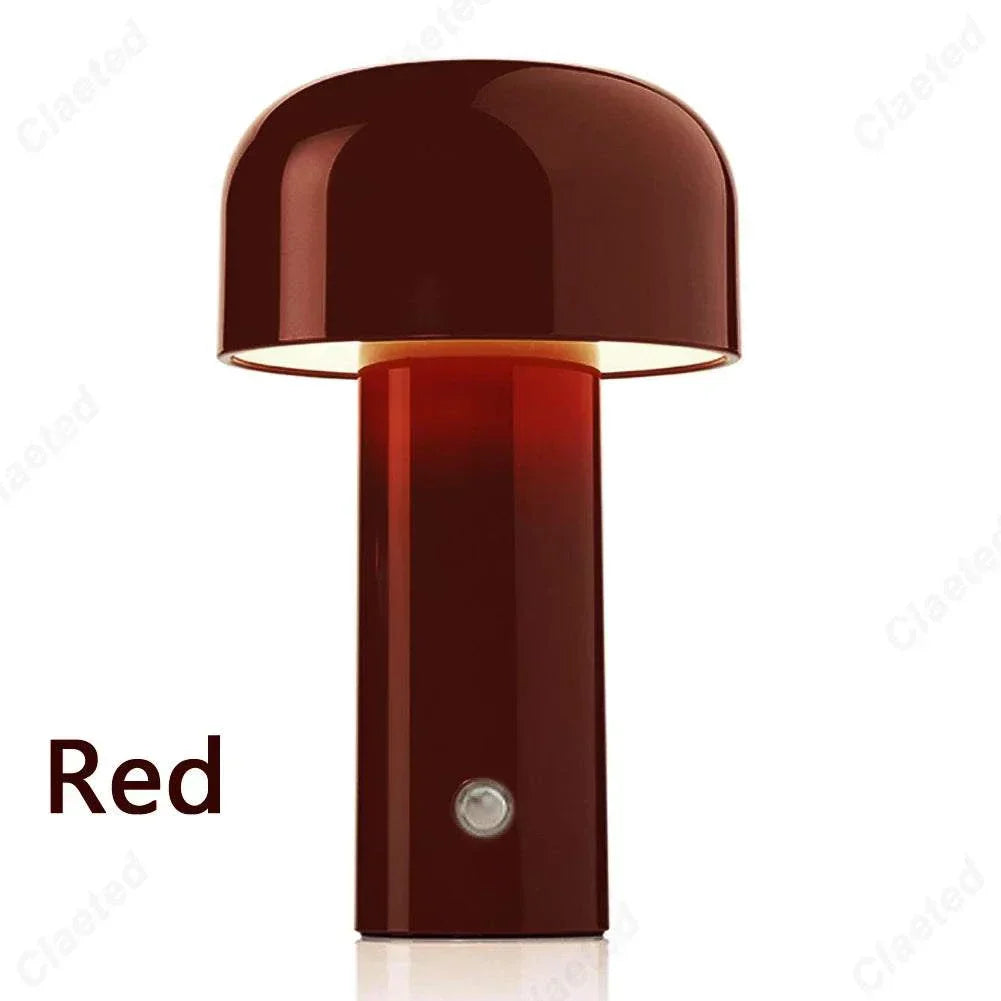 Red rechargeable portable table lamp with minimalist dome design, ideal for modern decor.