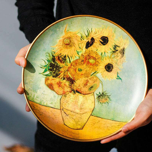 Hand-painted ceramic plate featuring Van Gogh's Sunflowers, showcasing vibrant colors and exquisite detail.