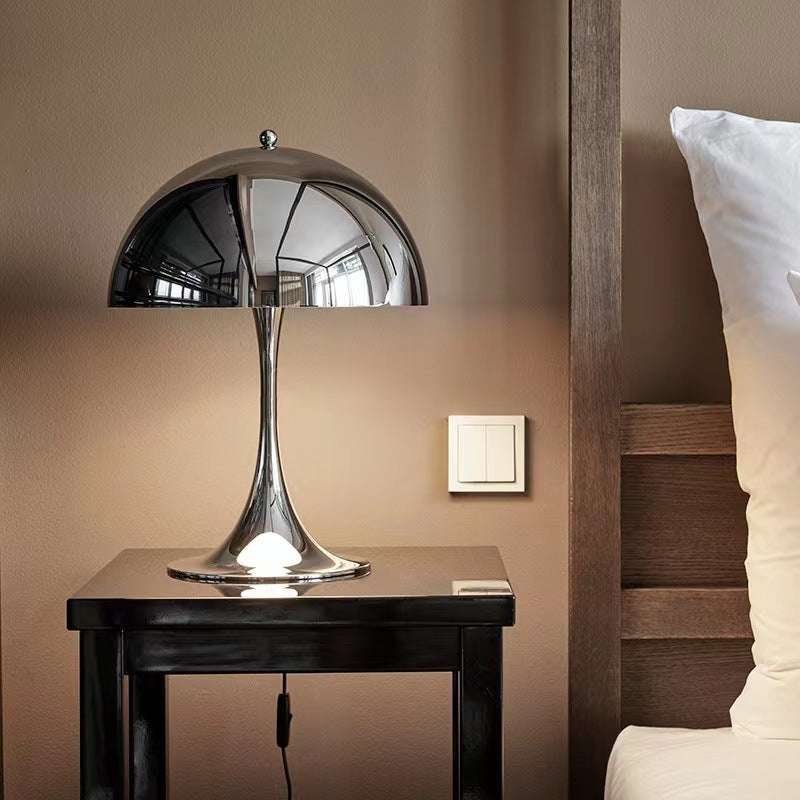 Modern Light - Iconic Danish Lamp on bedside table, modern design, metallic finish, ambient lighting.