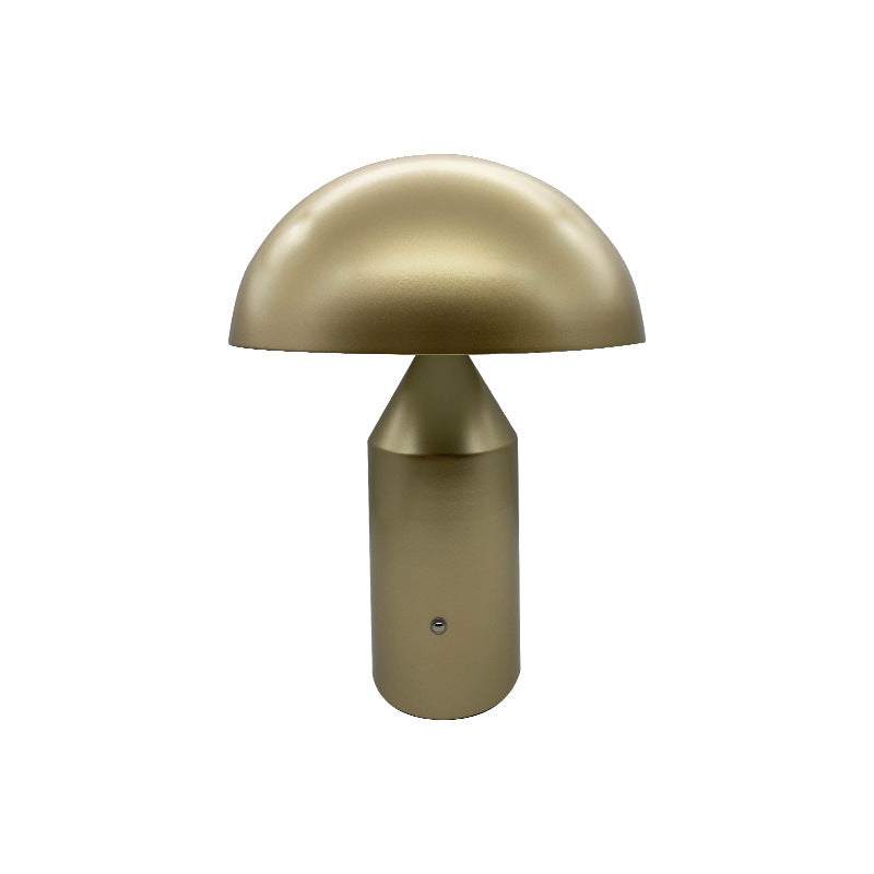 Golden Table Lamp Atollo with minimalist design and cylindrical base featuring a hemispherical shade.