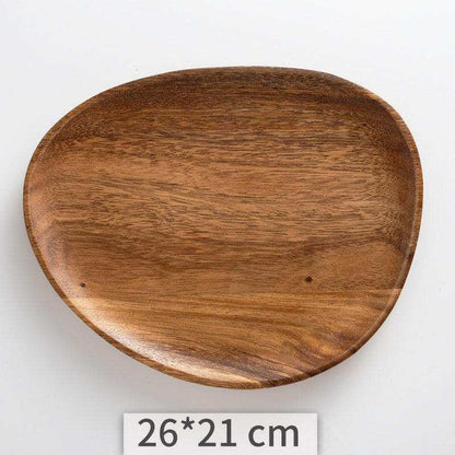 Irregular acacia wood tray with unique grain pattern and organic shape, measuring 26x21 cm.