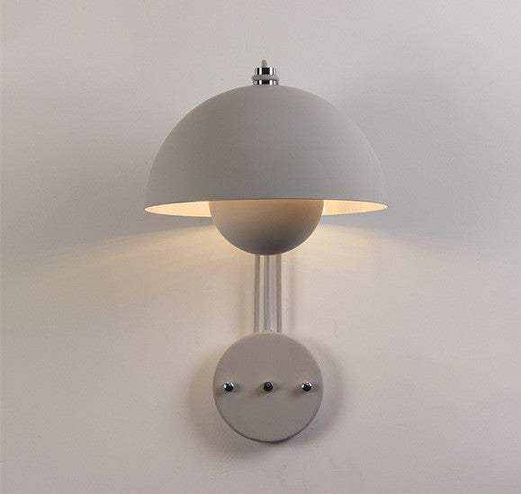 Flowerpot Lamp wall with dome-shaped shade and sleek design, offering a warm glow.