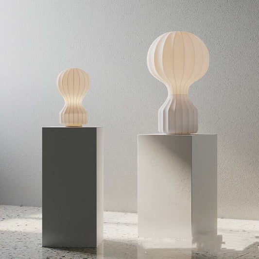 Paper Lamp gourd shape with white balloon  and dark base on pedestals.