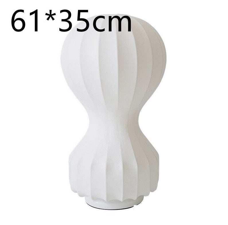 Paper Lamp gourd shape with white artistic balloon and vertical grooves on a dark base, 61x35cm.