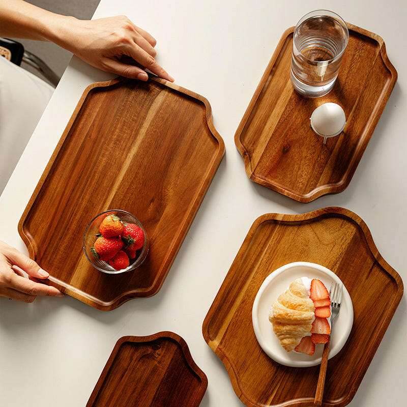 Serving Trays with food and drinks, showcasing its modern design and rich wood tones.